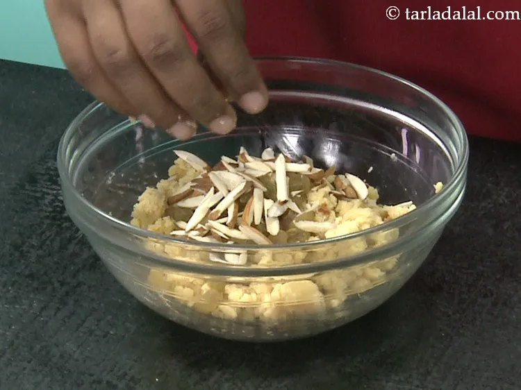 Step 29 – Add 2 tbsp&nbsp;<a href="https://www.tarladalal.com/glossary-almond-slivers-slivered-almonds-664i">almond slivers</a>.