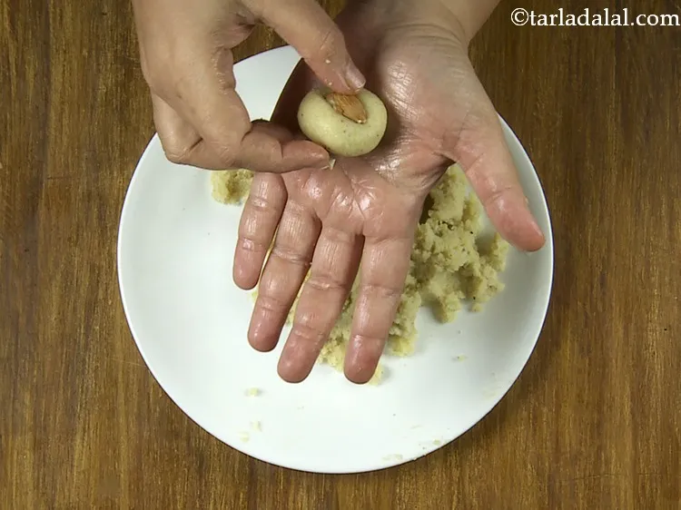 Step 16 – Place an almond halve in the depression. You can also use other dry-fruits like pistachio …