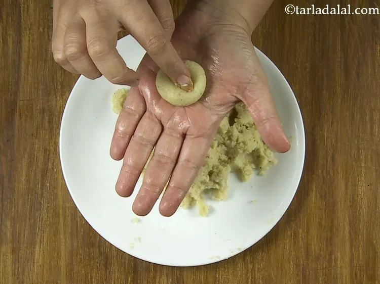 Step 17 – Press the almond halve lightly so it is secure.