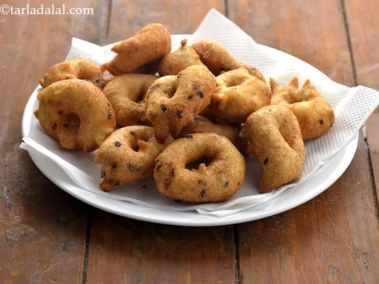 Step 33 – Flip and cook the urad dal vada till both sides turn golden brown in colour …