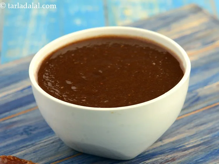 Step 33 – Then spread 1 tbsp of <a href="https://www.tarladalal.com/sweet-chutney-2360r">sweet chutney</a>.