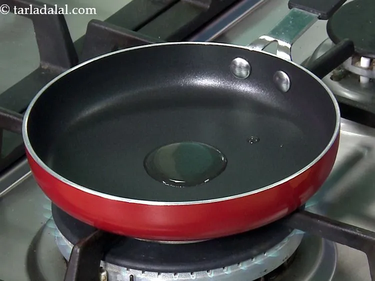 Step 2 – For <strong>garlic onion spread of methi and moong sprouts wrap</strong>, heat very little oil in …