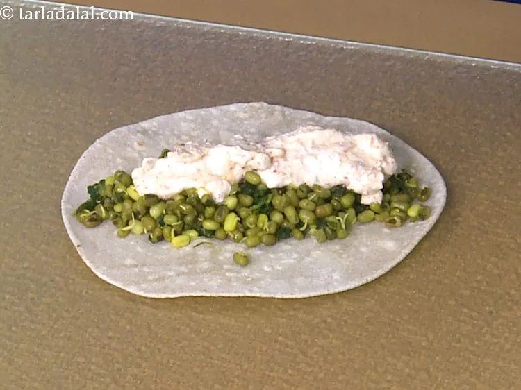 Step 42 – Spread 1 portion of the garlic onion spread evenly over it.