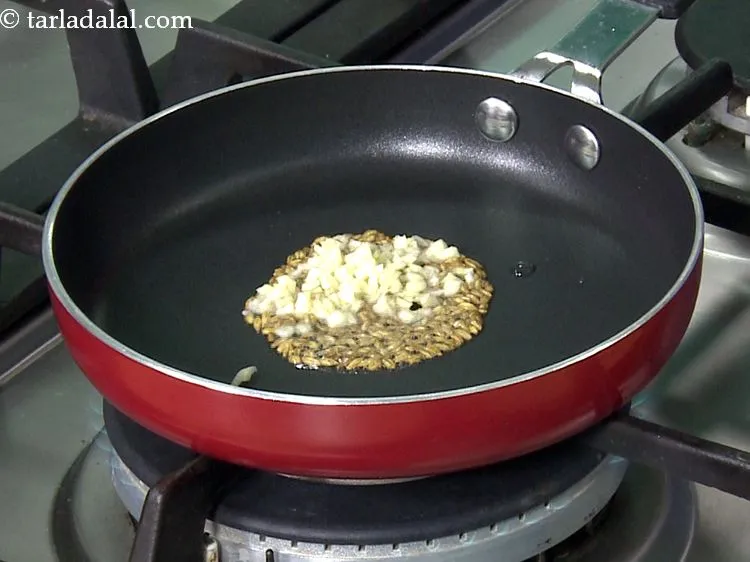 Step 4 – When the seeds crackle, add the garlic. We have used finely chopped garlic. If you …