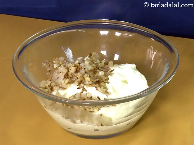 Step 8 – Add the saut&eacute;ed garlic and onions to the curd.