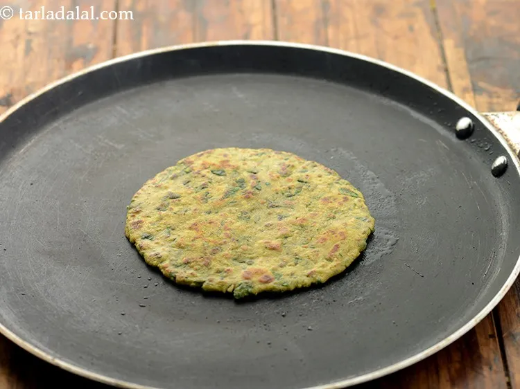 Step 13 – To cook&nbsp;<b><span style="font-size: 12pt; font-family: &quot;Kohinoor Devanagari Regular&quot;;">methi bajra paratha</span><span style="font-size: 12pt; font-family: Cambria, serif;">&nbsp;</span><span …