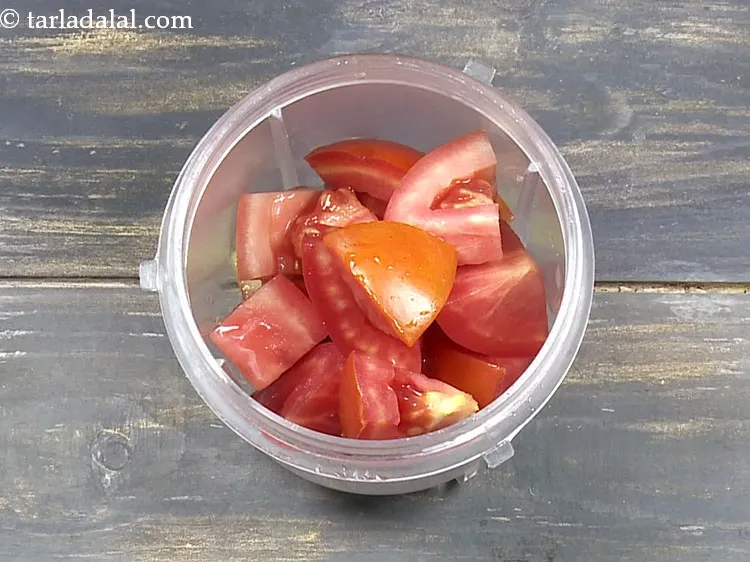 Step 29 – For the tomato paste, add 3/4 cup&nbsp;roughly&nbsp;<a href="https://www.tarladalal.com/glossary-chopped-tomatoes-779i">chopped tomatoes</a> in a mixer jar.