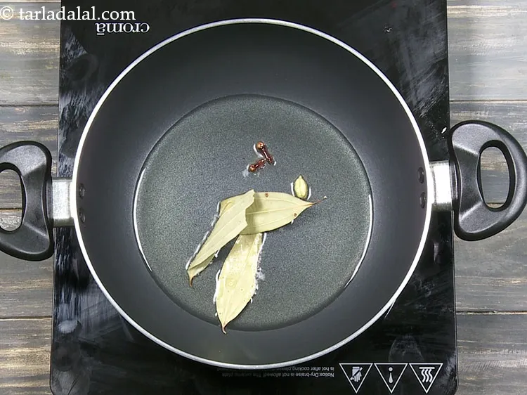 Step 36 – Add 2&nbsp;<a href="https://www.tarladalal.com/glossary-bayleaf-tejpatta-tej-patta-189i">bayleaves (tejpatta)</a>.