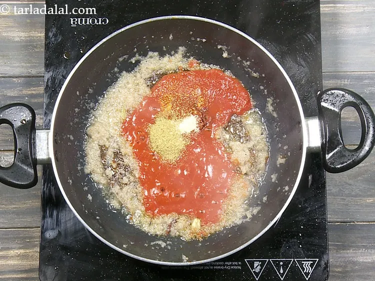 Step 45 – Add a pinch of&nbsp;<a href="https://www.tarladalal.com/glossary-asafoetida-hing-113i">asafoetida (hing)</a>.