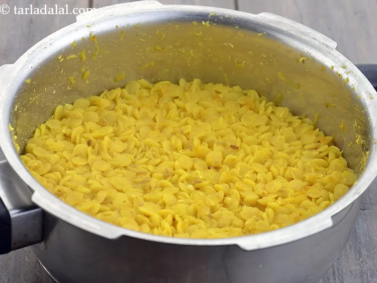 Step 17 – Mix well and pressure cook for 3 whistles. Allow the steam to escape before opening …