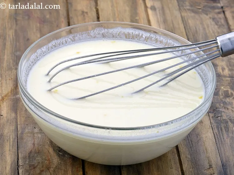 Step 29 – Add the curds-besan mixture.