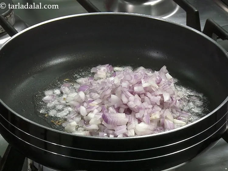 Step 29 – Add 3/4 cup&nbsp;finely&nbsp;<a href="https://www.tarladalal.com/glossary-chopped-onions-722i">chopped onions</a>.