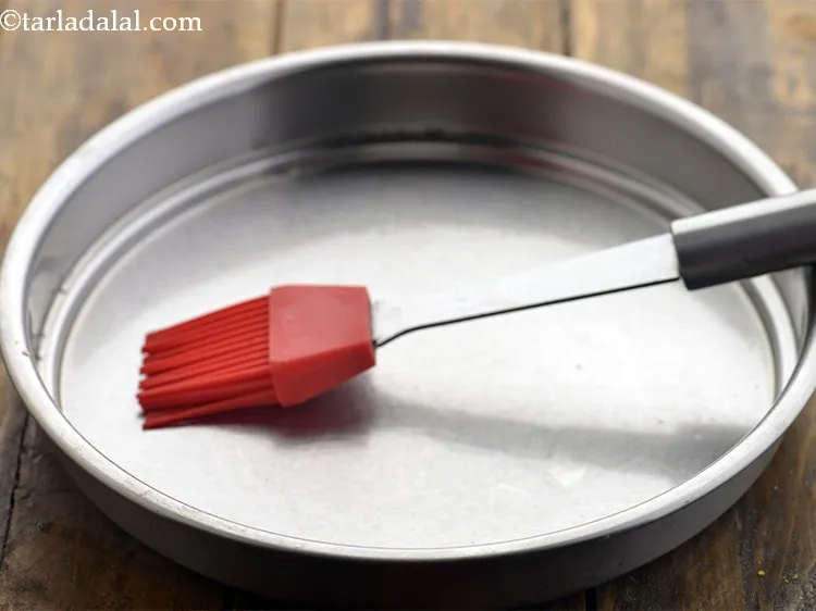 Step 8 – Remember to grease the thali with ghee / oil so demoulding the dhokla becomes easier.