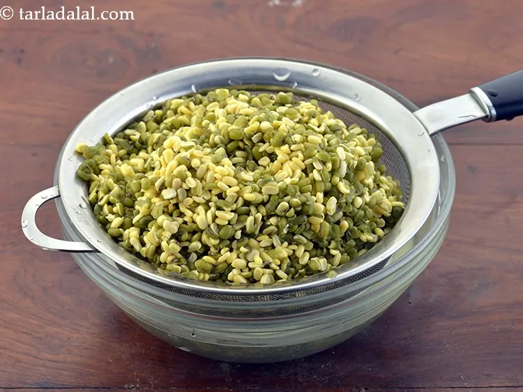 Step 17 – After 2 hours, drain the dal using a strainer. Discard the water. Keep the dal …