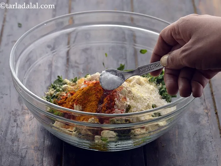 Step 16 – Add oil and salt to taste. Both soda and salt help in methi muthiyas softer.