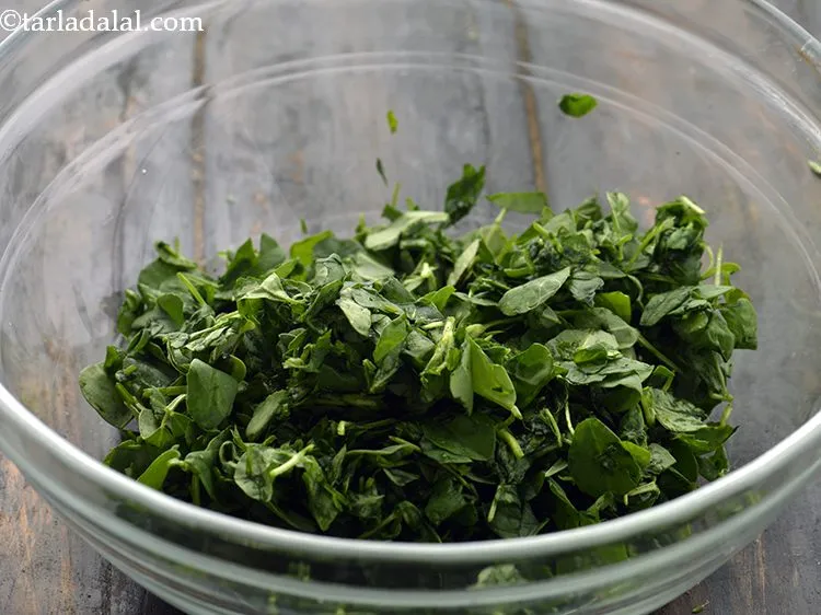 Step 8 – After 5 minutes, squeeze out all the excess liquid from the methi leaves. The squeezing …