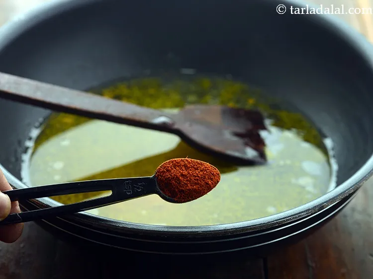 Step 9 – Add chilli powder for the much-needed spice.