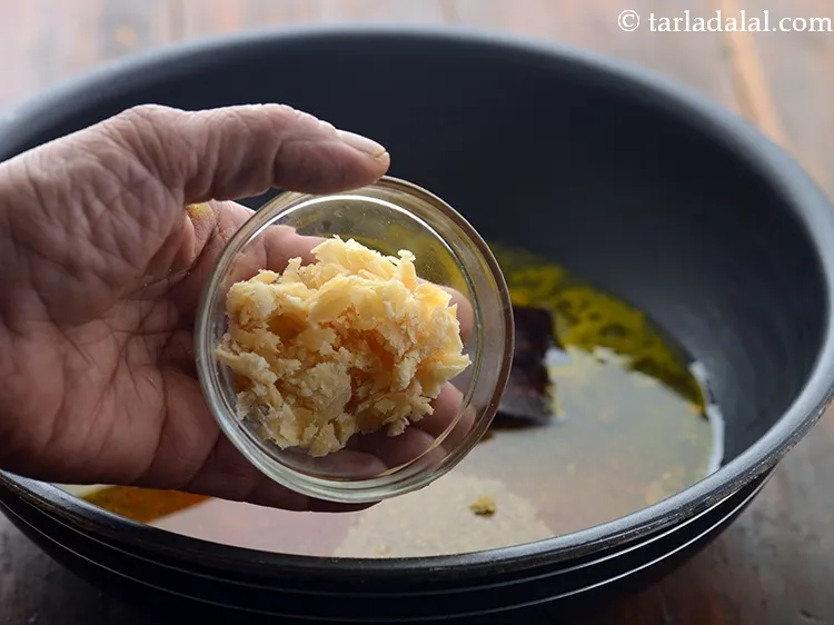 Step 11 – Add jaggery to cut the bitterness of fenugreek seeds in <strong>Methi dana sabzi</strong>.