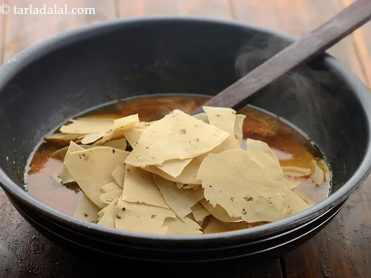 Step 15 – Add papad. Use any papad that is available or you like. We are using raw …