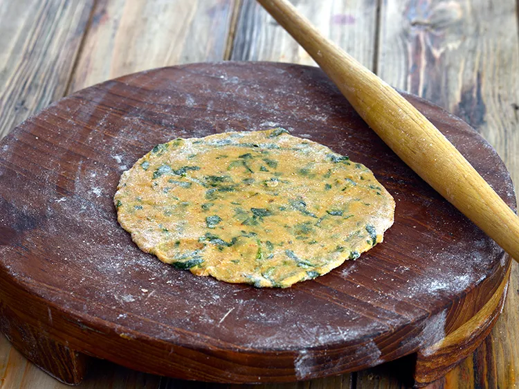 Step 13 – Roll it into a 150 mm. (6&rdquo;) diameter circle using a little whole wheat flour …