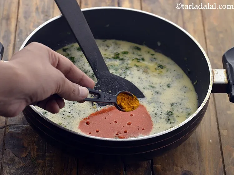 Step 15 – Add turmeric powder. These spices can also be added to the besan-water mixture.