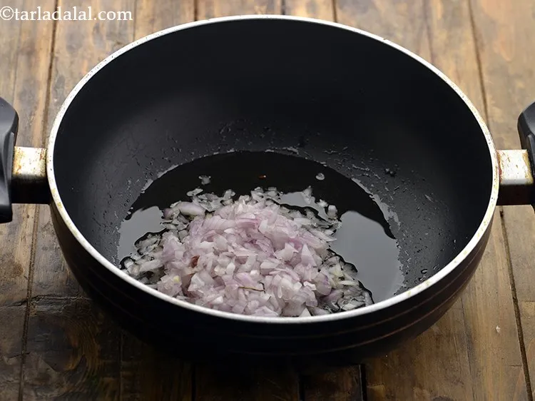 Step 6 – Once the oil is hot, add the onions.