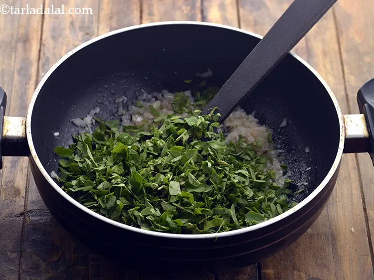 Step 9 – Add methi. It has been cleaned, washed and chopped before adding.