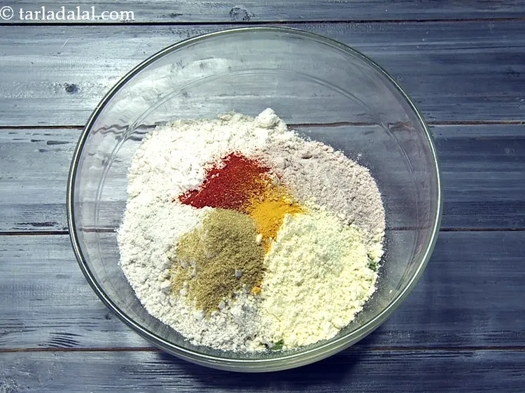 Step 25 – Add 1 tsp&nbsp;<a href="https://www.tarladalal.com/glossary-coriander-powder-dhania-powder-370i">coriander (dhania) powder</a>.