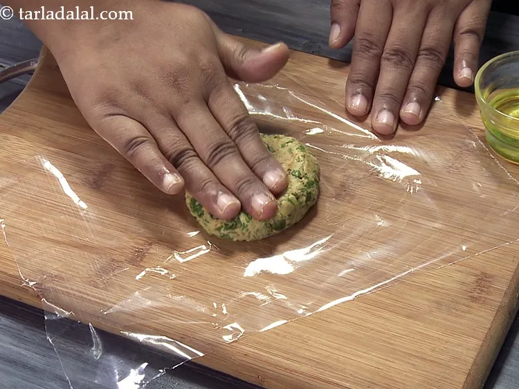 Step 35 – Place a portion of the dough on the greased plastic sheet.