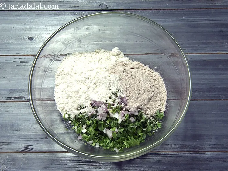 Step 20 – Add 1/4 cup&nbsp;<a href="https://www.tarladalal.com/glossary-ragi-flour-nachni-flour-nachni-ka-atta-red-millet-flour-1115i">ragi (nachni / red millet) flour</a>.