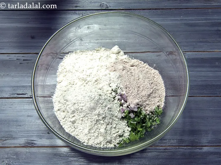 Step 21 – Add&nbsp;1/2 cup&nbsp;<a href="https://www.tarladalal.com/glossary-bajra-flour-bajra-ka-atta-bajre-ka-atta-176i">bajra (black millet) flour</a>.