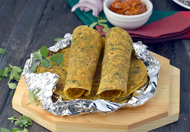 Step 27 – Serve immediately or cool the <strong>Methi Theplas </strong>and wrap in an aluminium foil. Pack them …