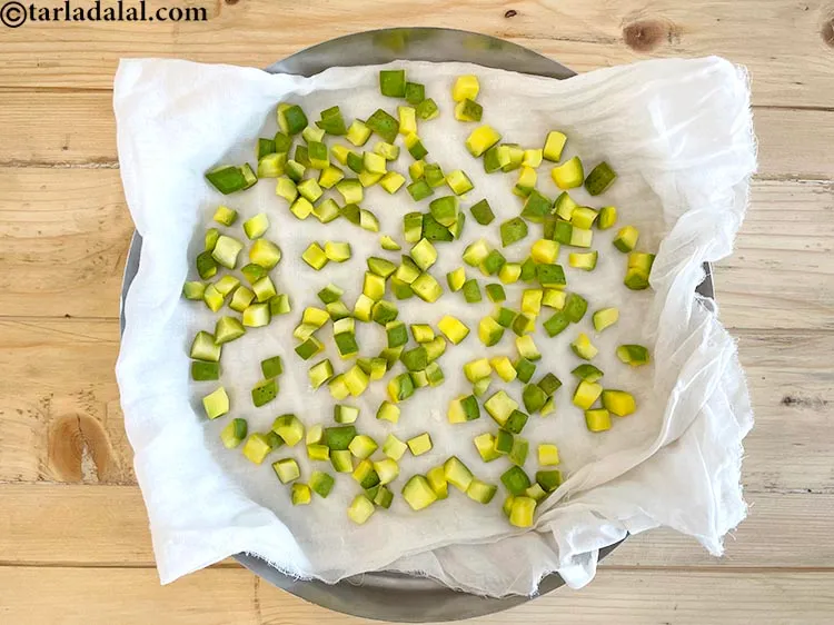 Step 32 – The best way to dry the raw mango cubes quickly is to place the keri …