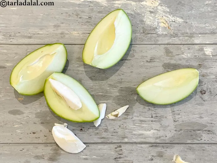 Step 4 – <meta charset="UTF-8" />Cut in half and remove the seeds and discard.&nbsp;