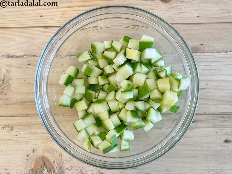 Step 6 – In a deep bowl put&nbsp;<meta charset="UTF-8" />1 1/2 cups&nbsp;<a href="glossary-raw-mango-cubes-2034i">raw mango cubes</a>.