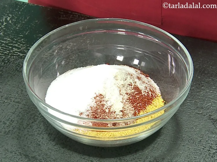 Step 11 – Add salt. This helps in increasing the shelf life of the instant <strong>Gujarati achaar masala</strong>