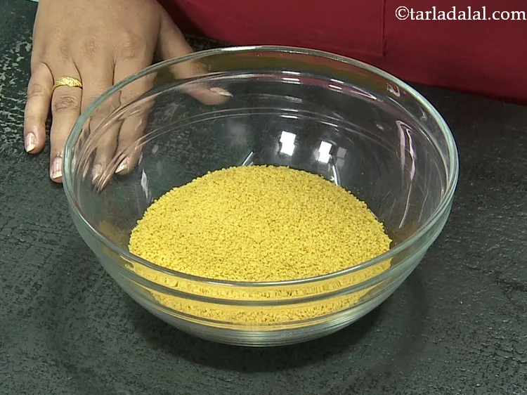 Step 7 – Transfer the coarse split mustard seeds to the same bowl of split fenugreek seeds.
