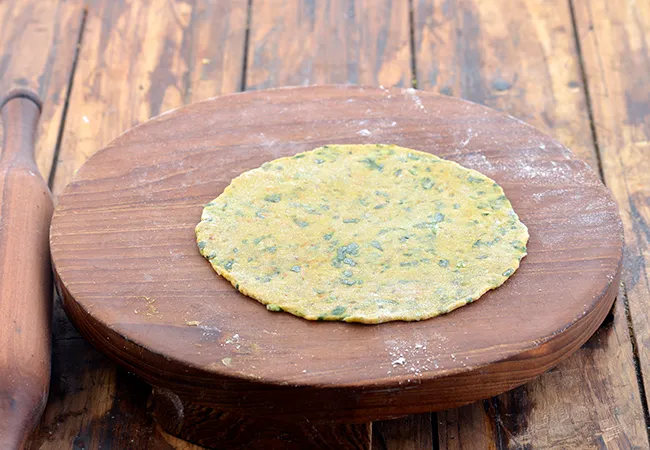 Step 22 – Roll out each portion into a 150 mm. (6&quot;) diameter circle using a rolling pin.