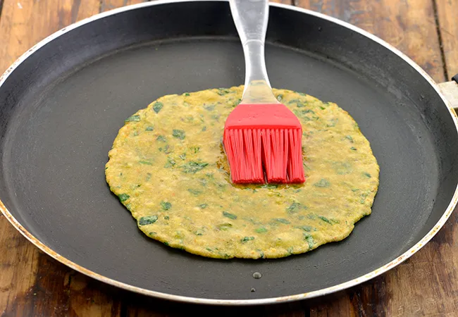 Step 24 – Apply a little oil, and let it turn golden brown on one side.