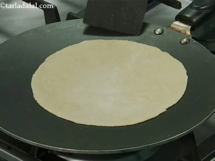 Step 14 – Heat a non-stick tava (griddle) on a high flame and when hot, place the tortilla …