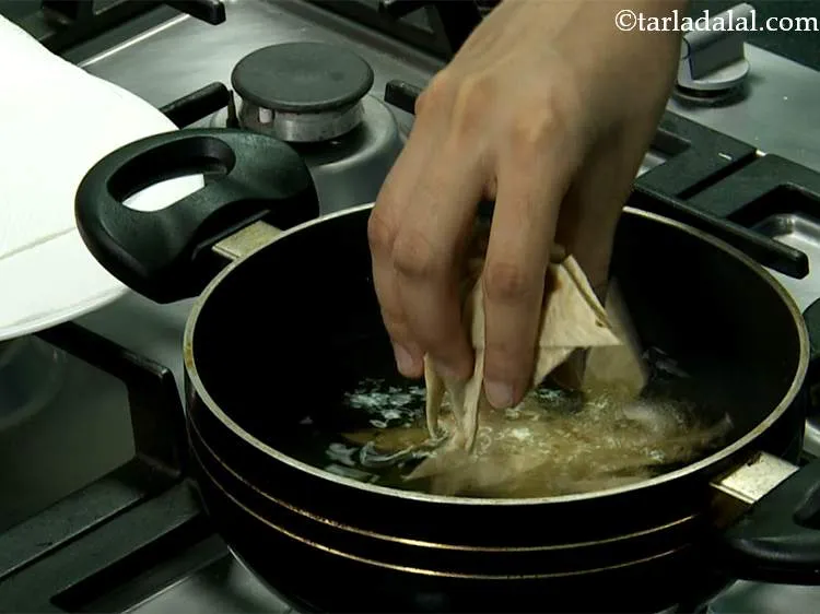 Step 18 – Meanwhile, heat oil in dep non-stick pan or kadhai. Once the oil is heated thoroughly, …