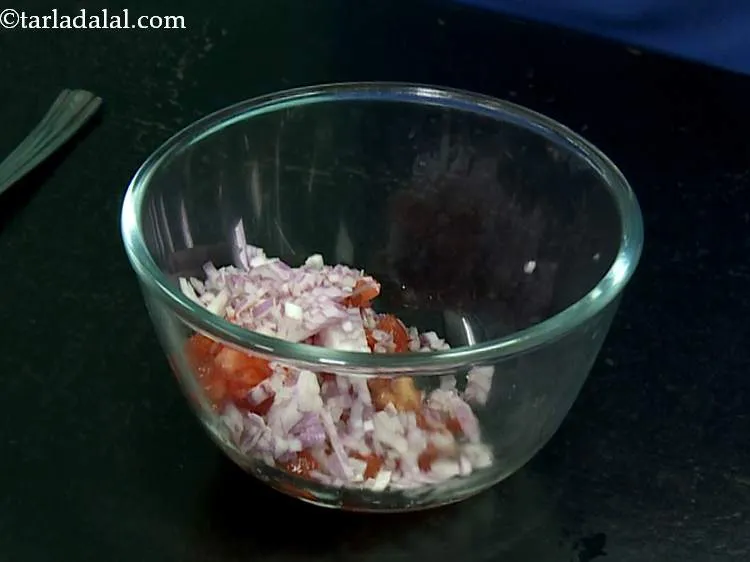 Step 2 – To this, add the finely chopped onions. Even though this salsa is uncooked, the onions …