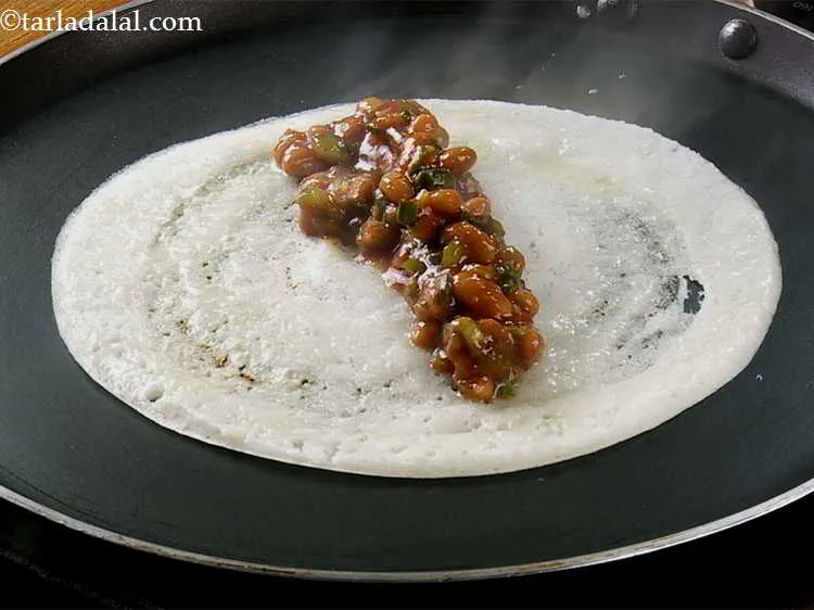 Step 19 – Place one portion of the Mexican stuffing in a row in the center.