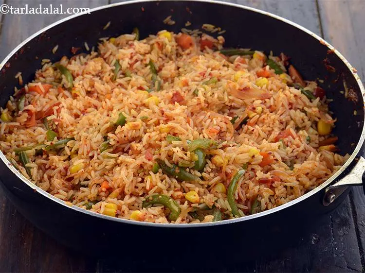 Step 32 – Cook&nbsp;<strong>Vegetarian</strong>&nbsp;<strong>Mexican Fried Rice&nbsp;</strong>on a medium flame for 2 to 3 minutes, while stirring occasionally. Be …
