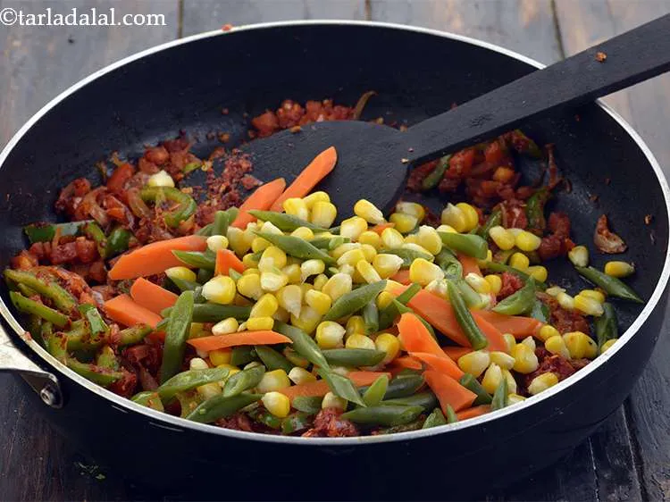 Step 50 – Add 1 cup&nbsp;<a href="https://www.tarladalal.com/glossary-boiled--mixed-vegetables-1018i">boiled mixed vegetables</a> to the pan. you can boil these vegetables on …