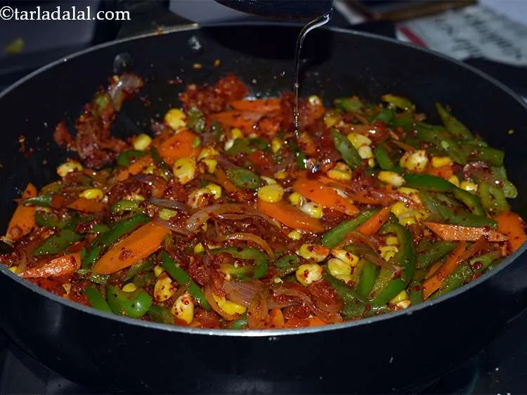 Step 51 – Add 1 more tbsp of water so that the veggies don&#39;t burn.