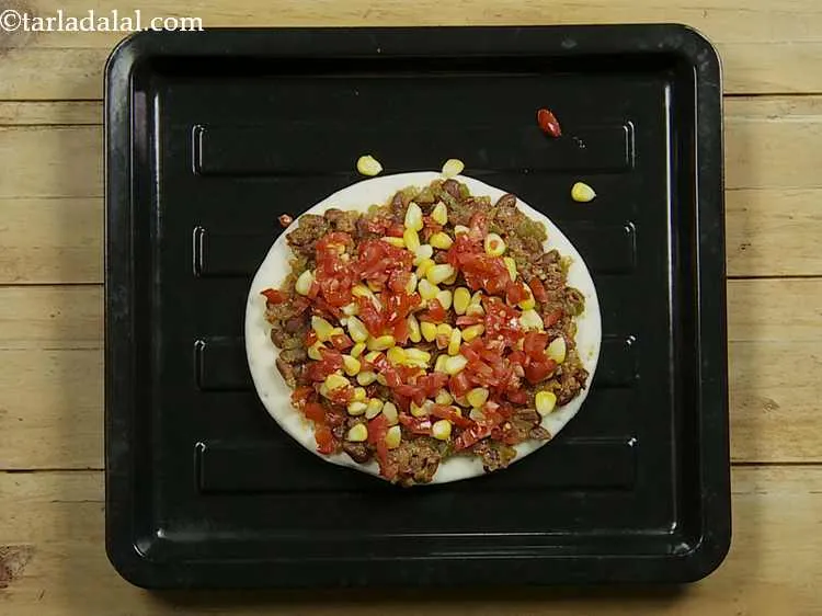 Step 11 – Now top with ? cup of tomatoes. You can also use sliced olives and jalapenos …