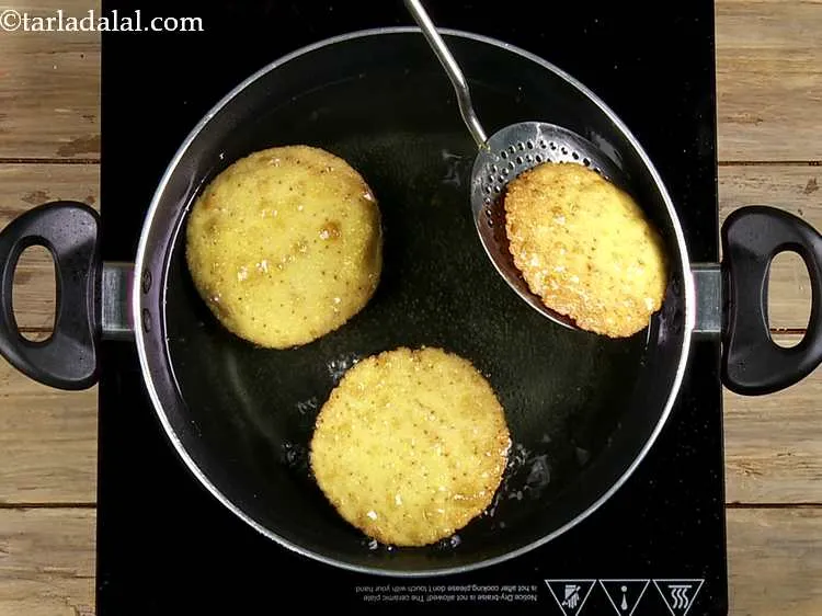 Step 12 – Heat the oil in a deep-non-stick kadhai and deep-fry a few tortillas at a time …