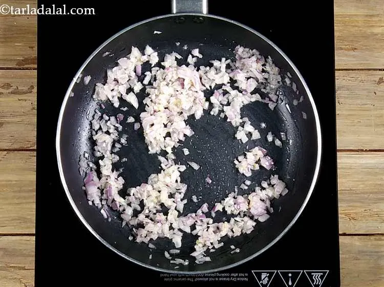 Step 21 – Mix well and saut&eacute; on a medium flame for 1 minute. The onions should not …