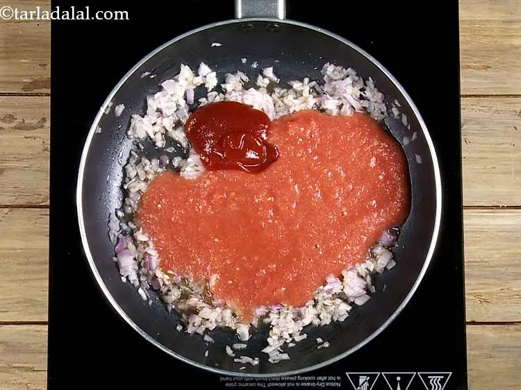 Step 23 – Now add the tomato ketchup for a slight tang and sweetness in the rajma topping …